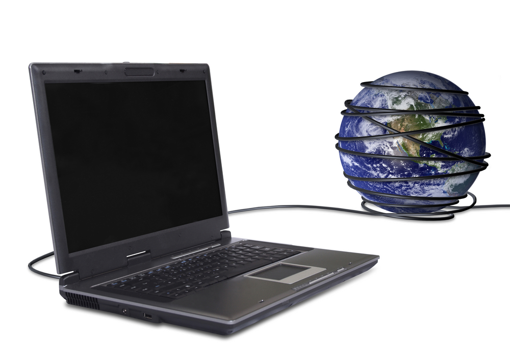 business laptop connected to the globe, online communications