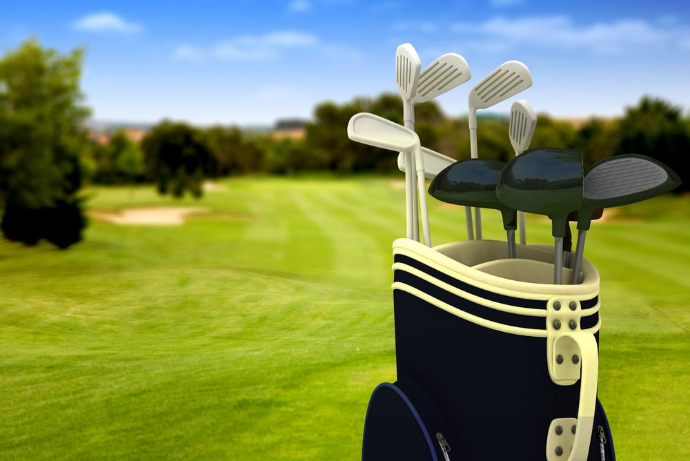 golf clubs on a golf course on a beautiful sunny day